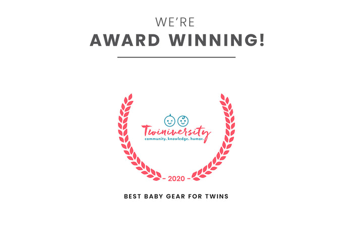 Little Folks by Delta Children Aqua Geo (2040) Twin EZ Fold Ultra Compact Double Bassinet Badge