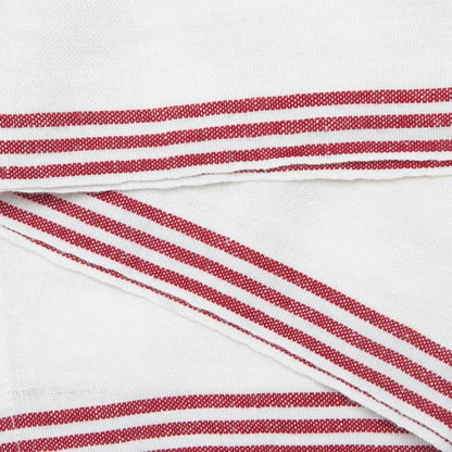 White woven fabric with red and white striped borders, shown folded to highlight the textile texture and stripe pattern.