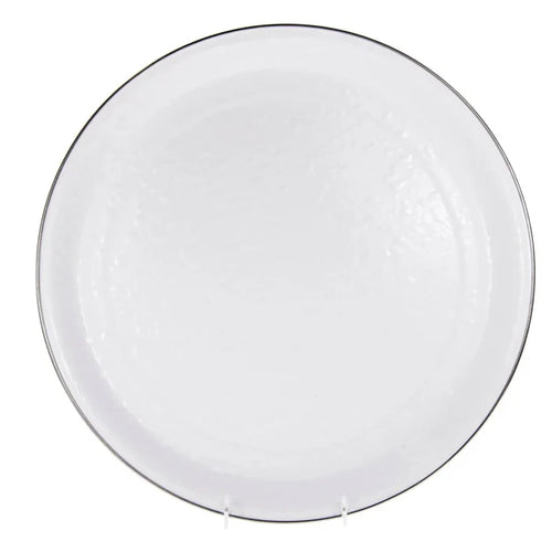 enamel serving tray with silver rim on a white background