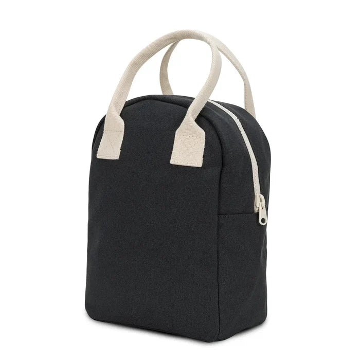 Black bag with beige handles and zipper on a white background