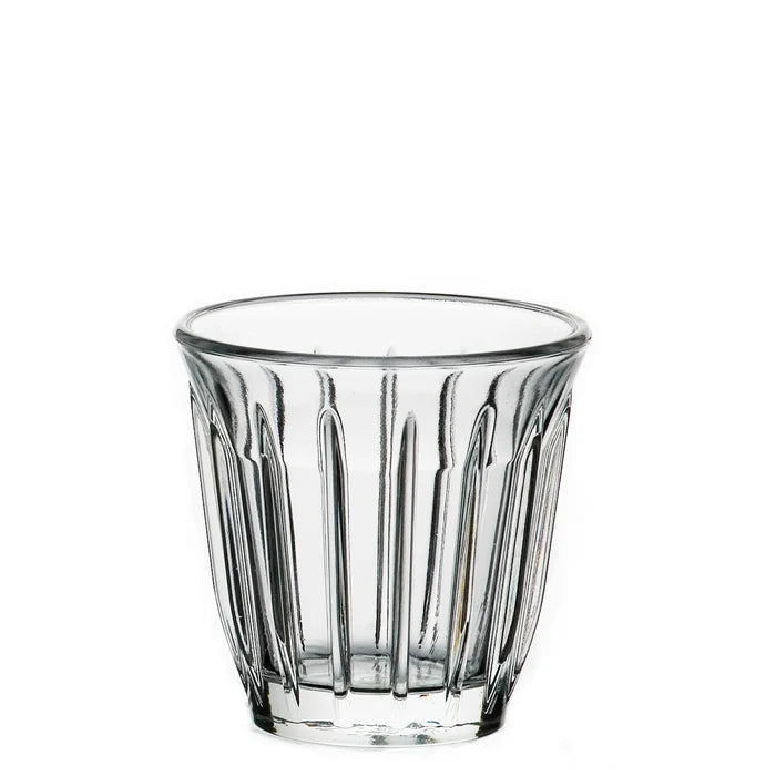 Clear glass tumbler with vertical ridges on a white background